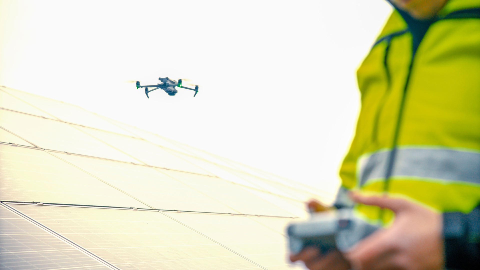Technician uses Drone to Inspect Solar Panels