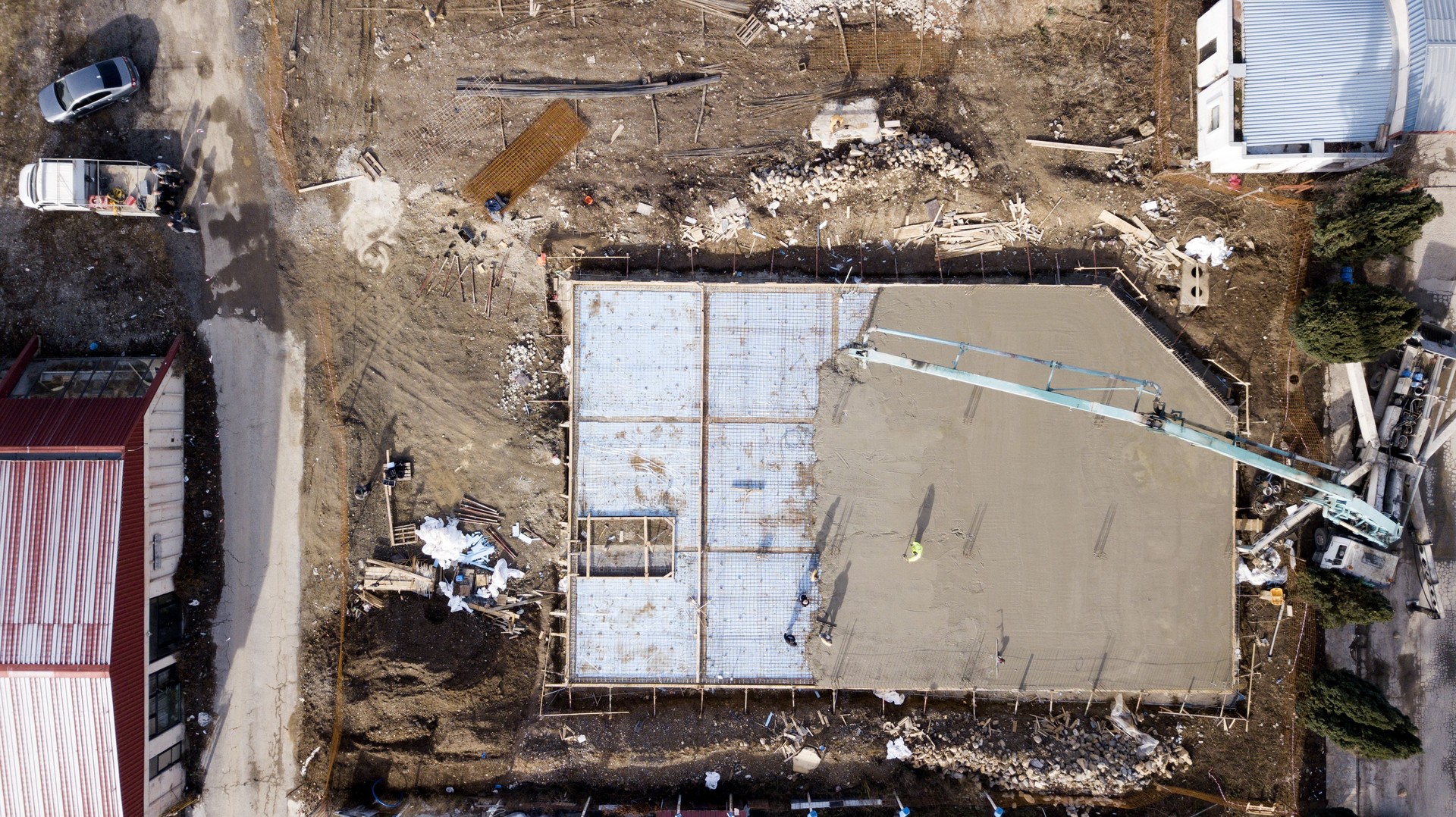 drone image, aerial wiev of a construction site during pouring cement,